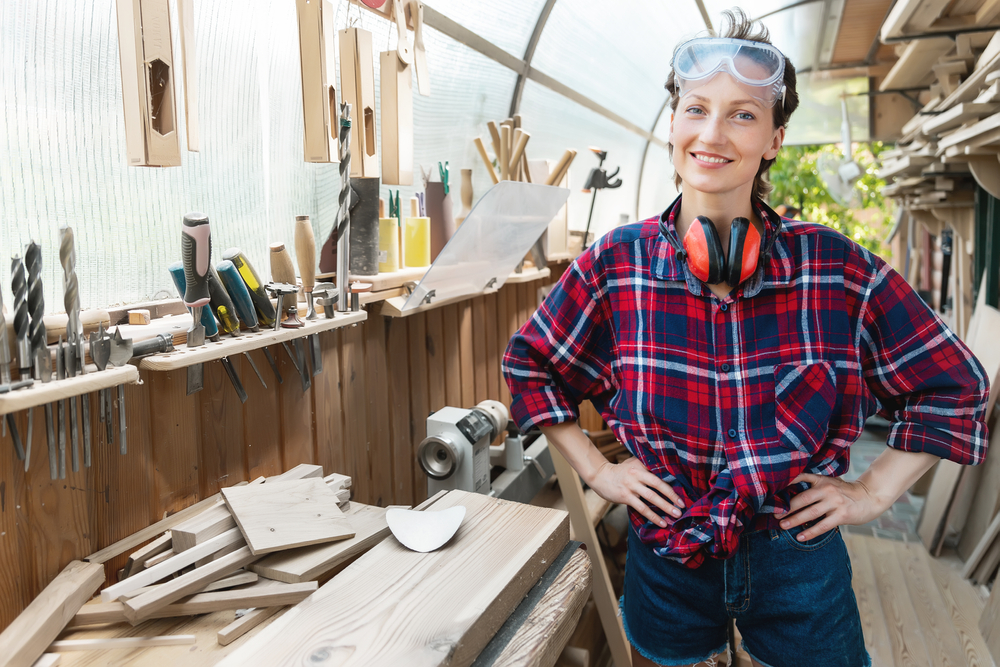 Woman cutting wood