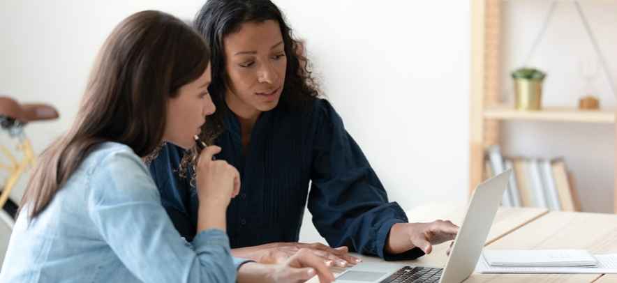 Two women at laptop