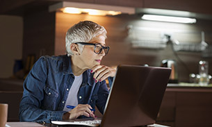Photo of woman working at laptop 