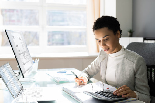 A woman working at a laptop