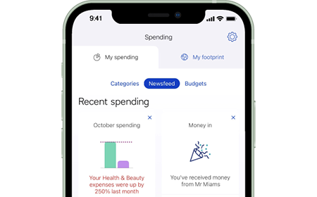 Mobile banking app screenshot showing Spending newsfeed