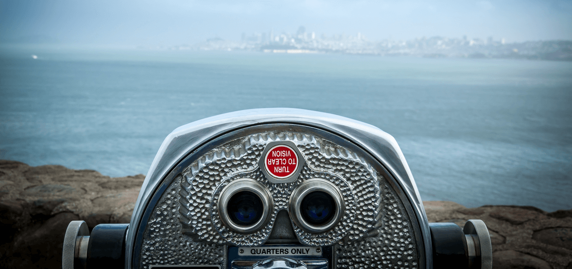 coin operated binoculars, looking out over a bay