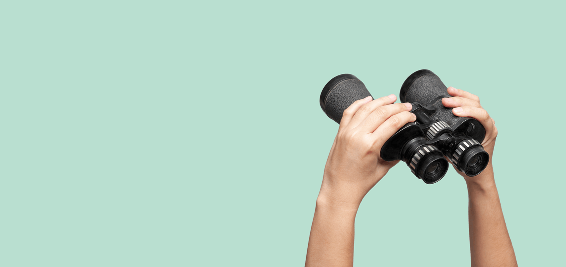 photo of hands holding binoculars