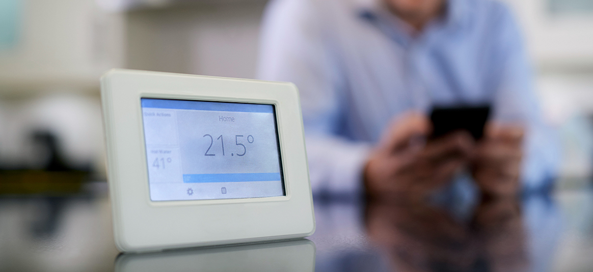 Photo of a digital thermostat on a table