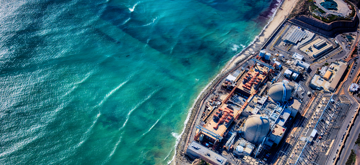 An aerial view of a harbour side nuclear plant