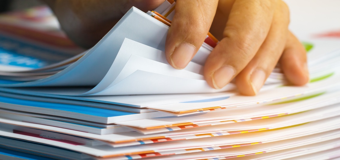 photo of a pile of documents being looked through