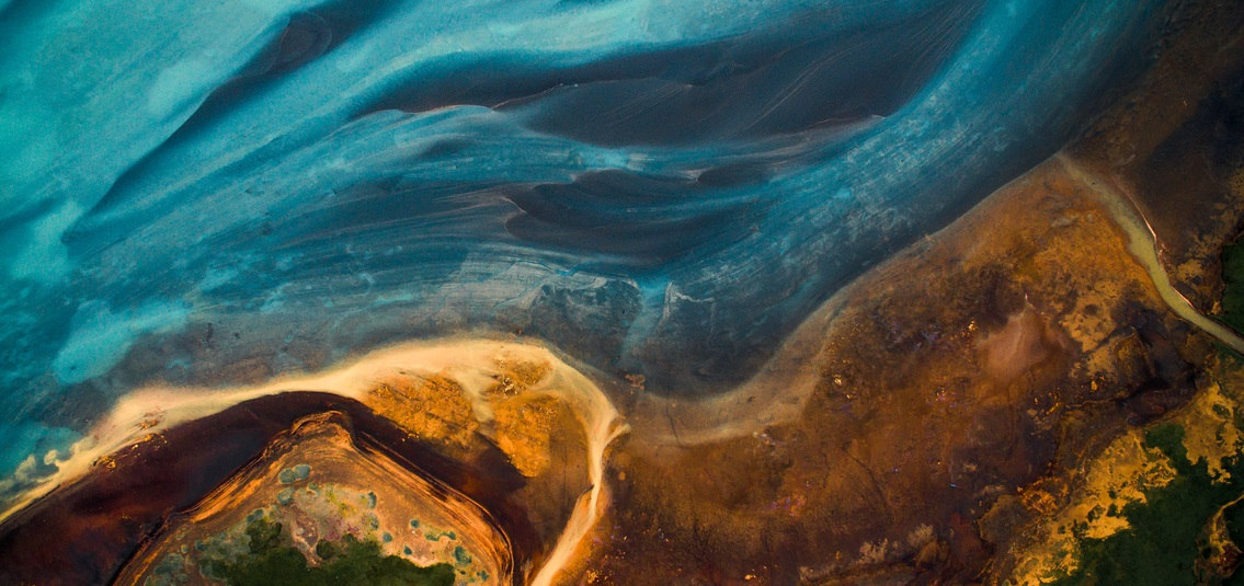 illustration of coastline and sea, as seen from the sky