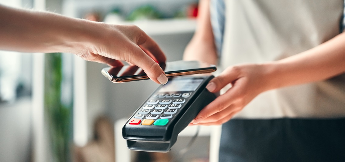 Close up of someone making a contactless payment