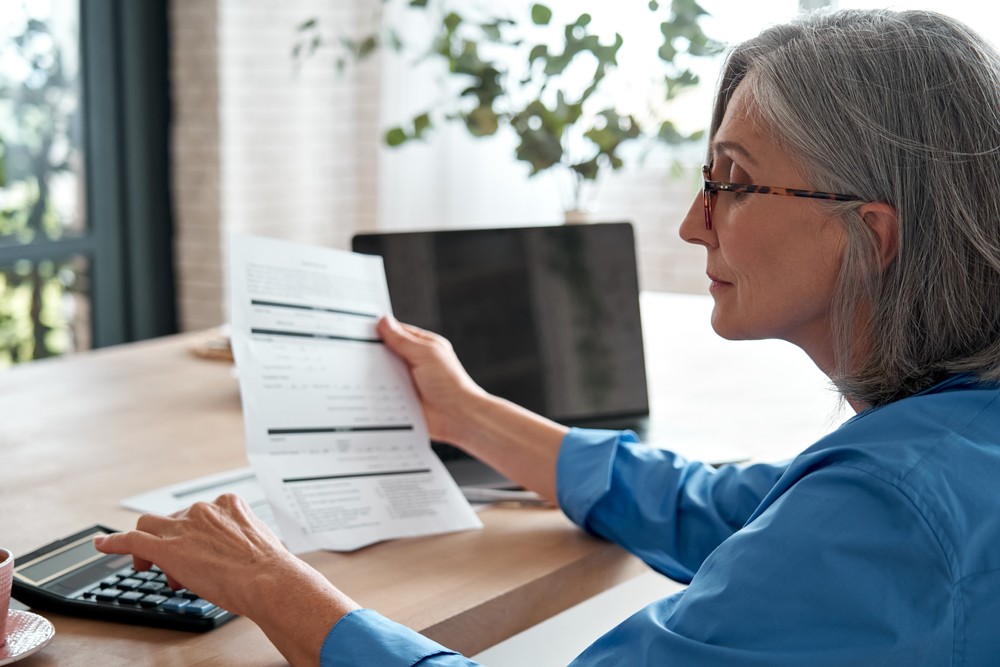 Woman calculating her bills