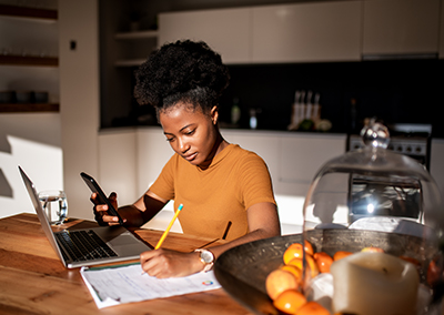 Woman sitting at her desk applying for a loan